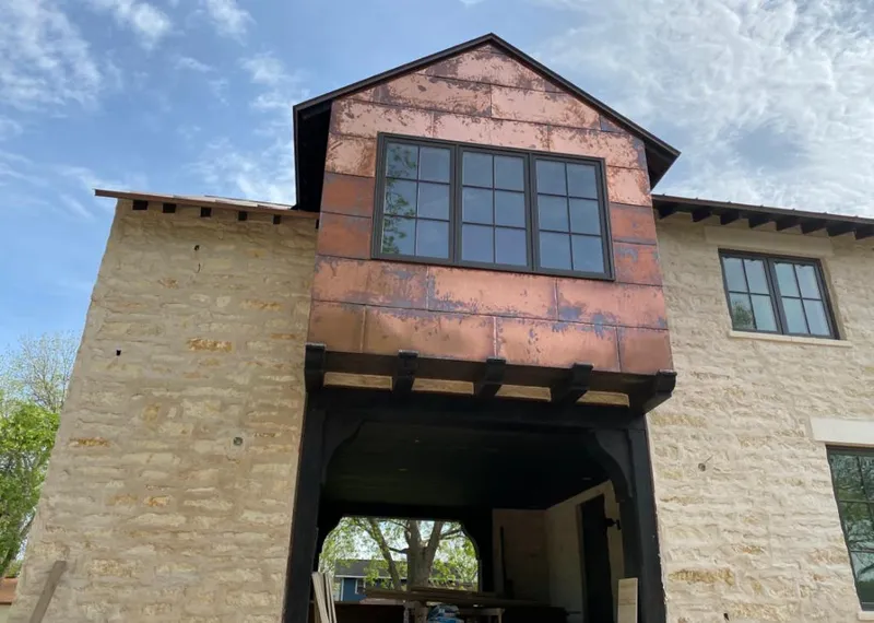 Copper metal panel facade on a stone building for Metal Roof Coating in Yucaipa
